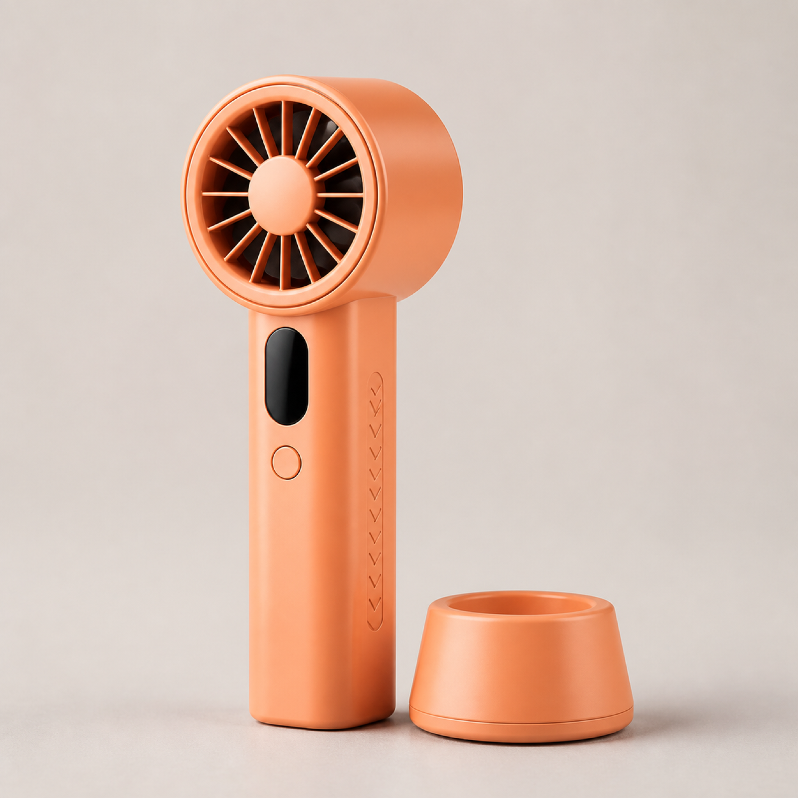 Orange handheld turbo fan with matching desktop stand and patented exterior design