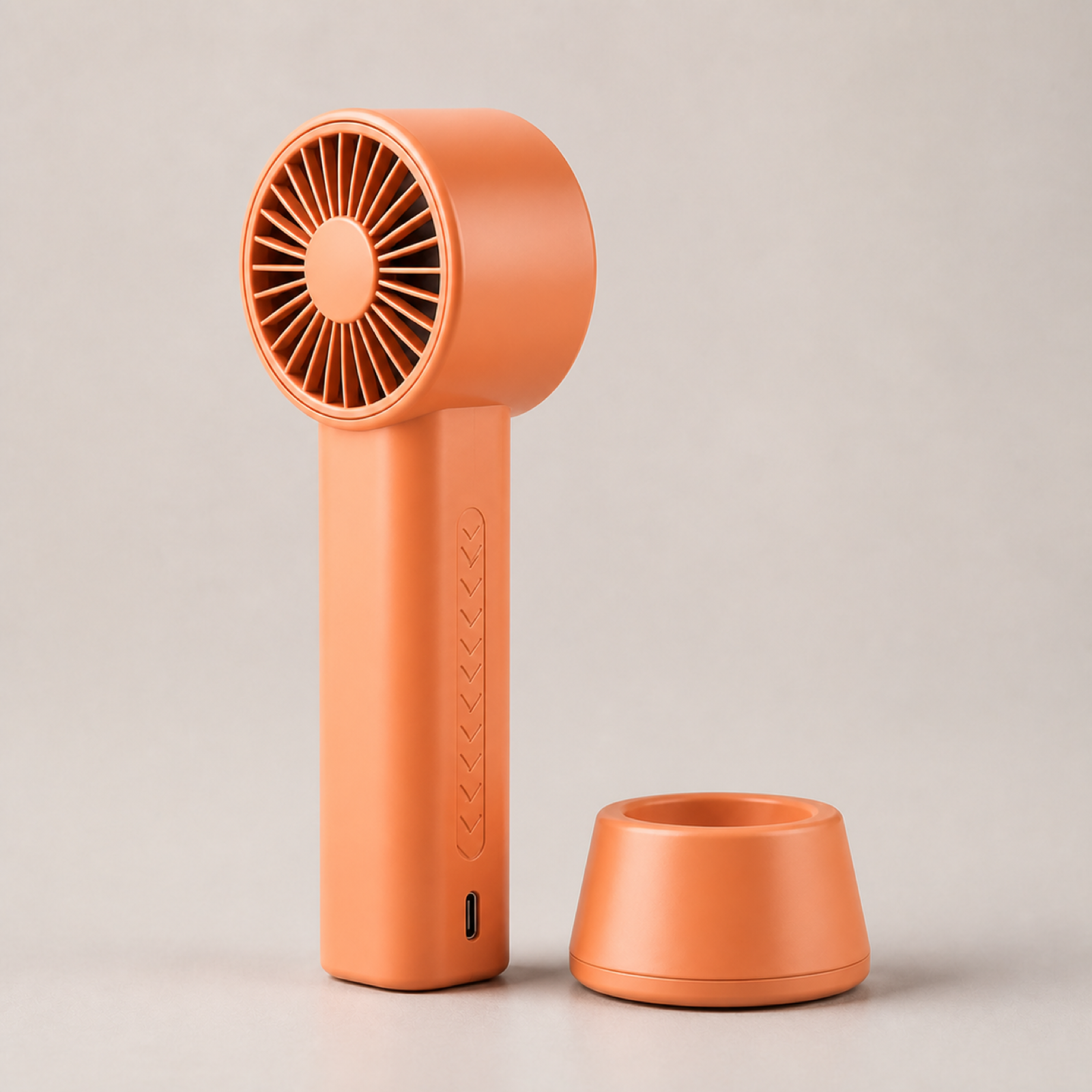 Handheld turbo fan from another angle showing slim handle and compact turbine head