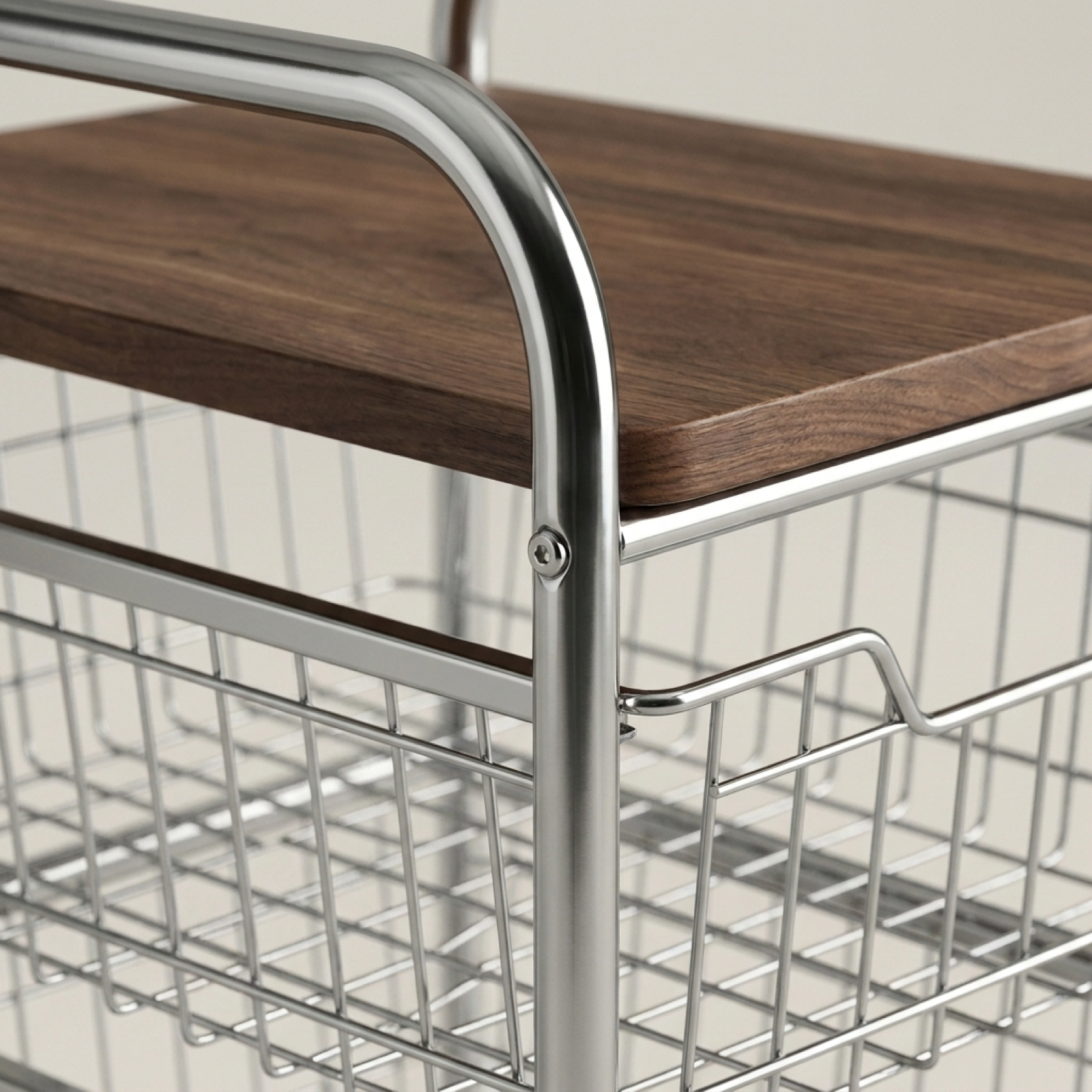Polished metal frame connection detail on rolling storage cart