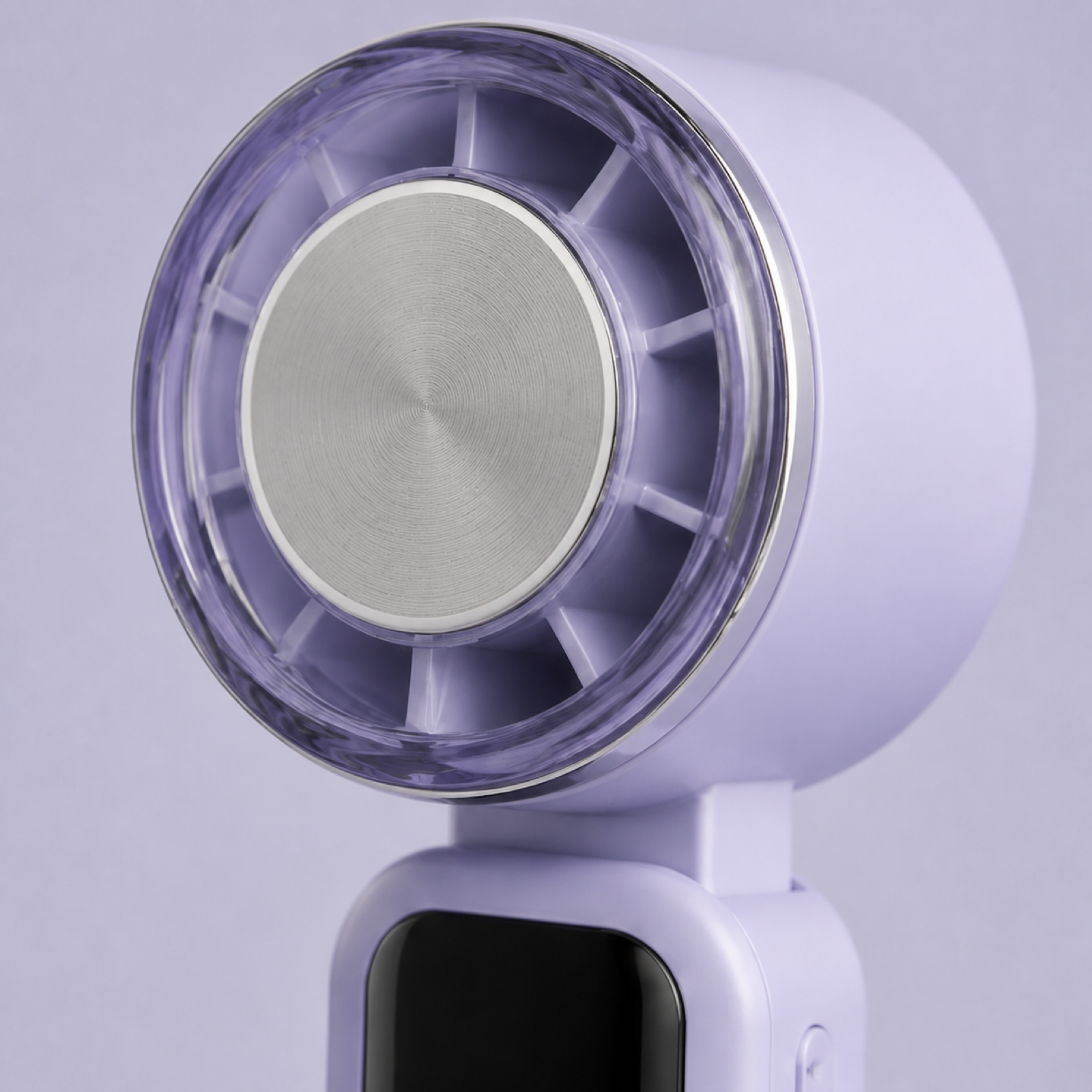Close-up of metal cold plate on handheld personal cooling fan