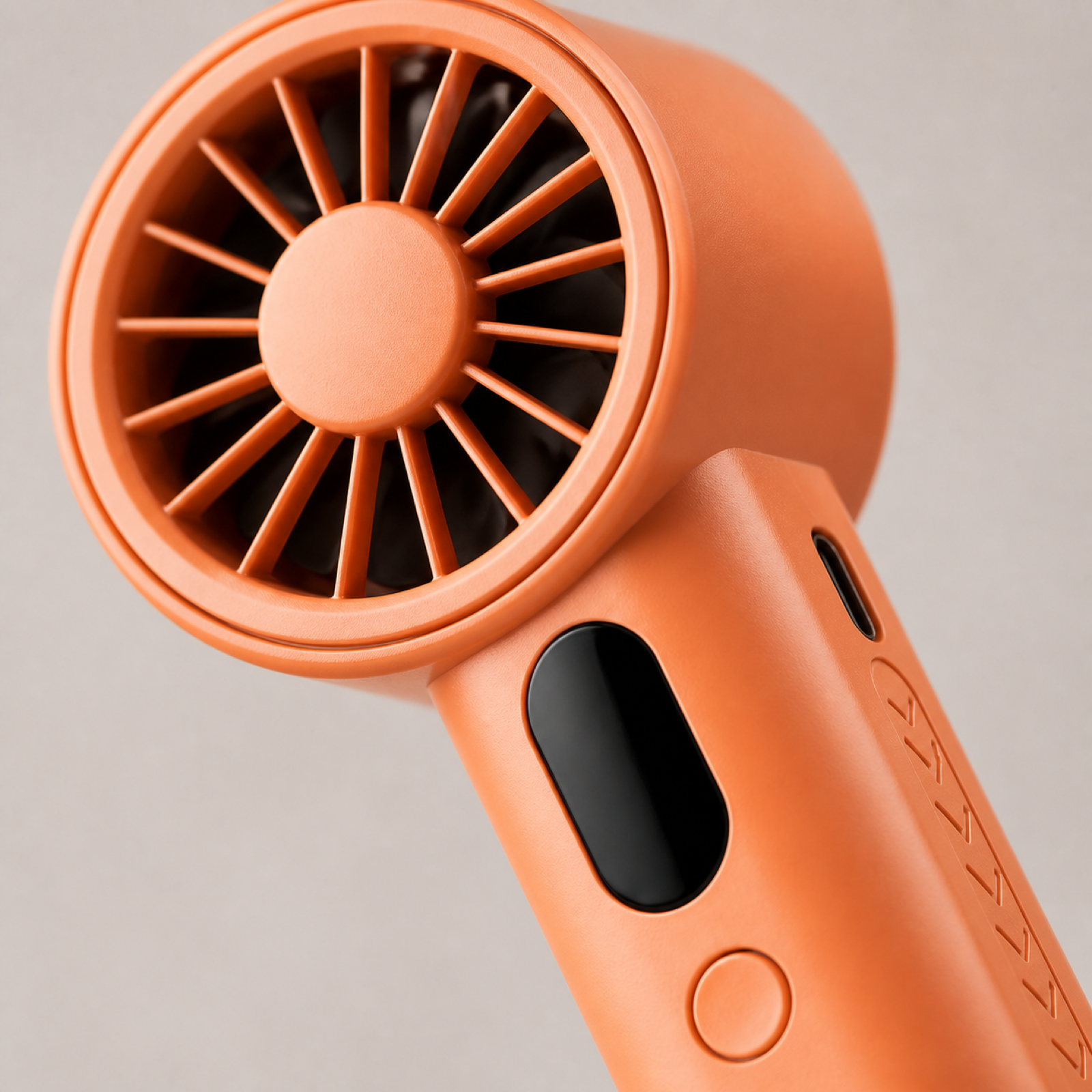 Close-up of handheld fan turbine grille and focused airflow structure