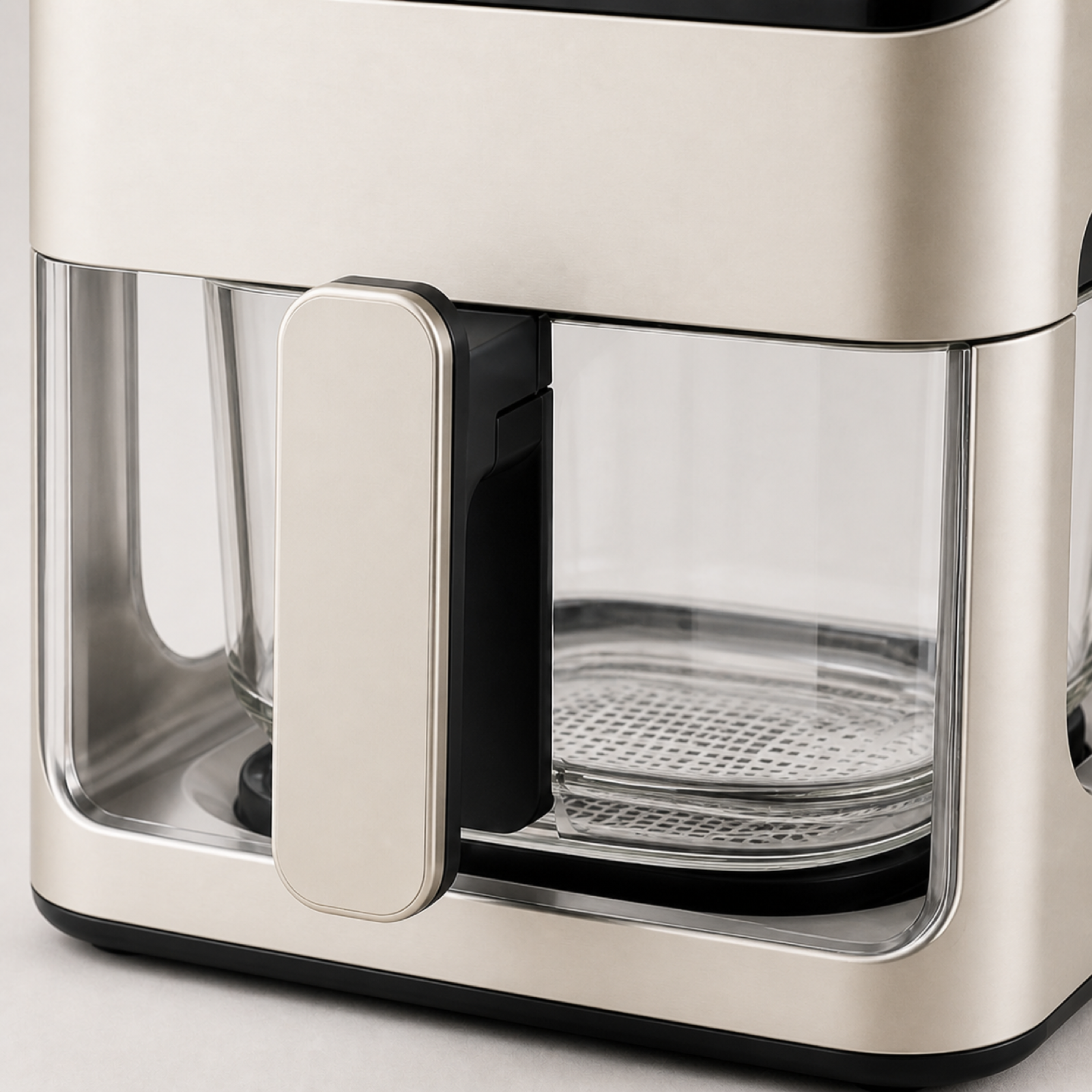 Visible air fryer with transparent cooking chamber and removable basket