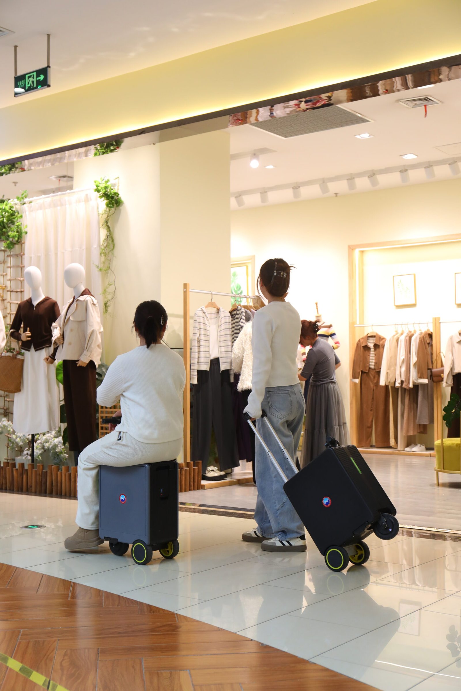 Woman effortlessly riding the Glade motorized luggage