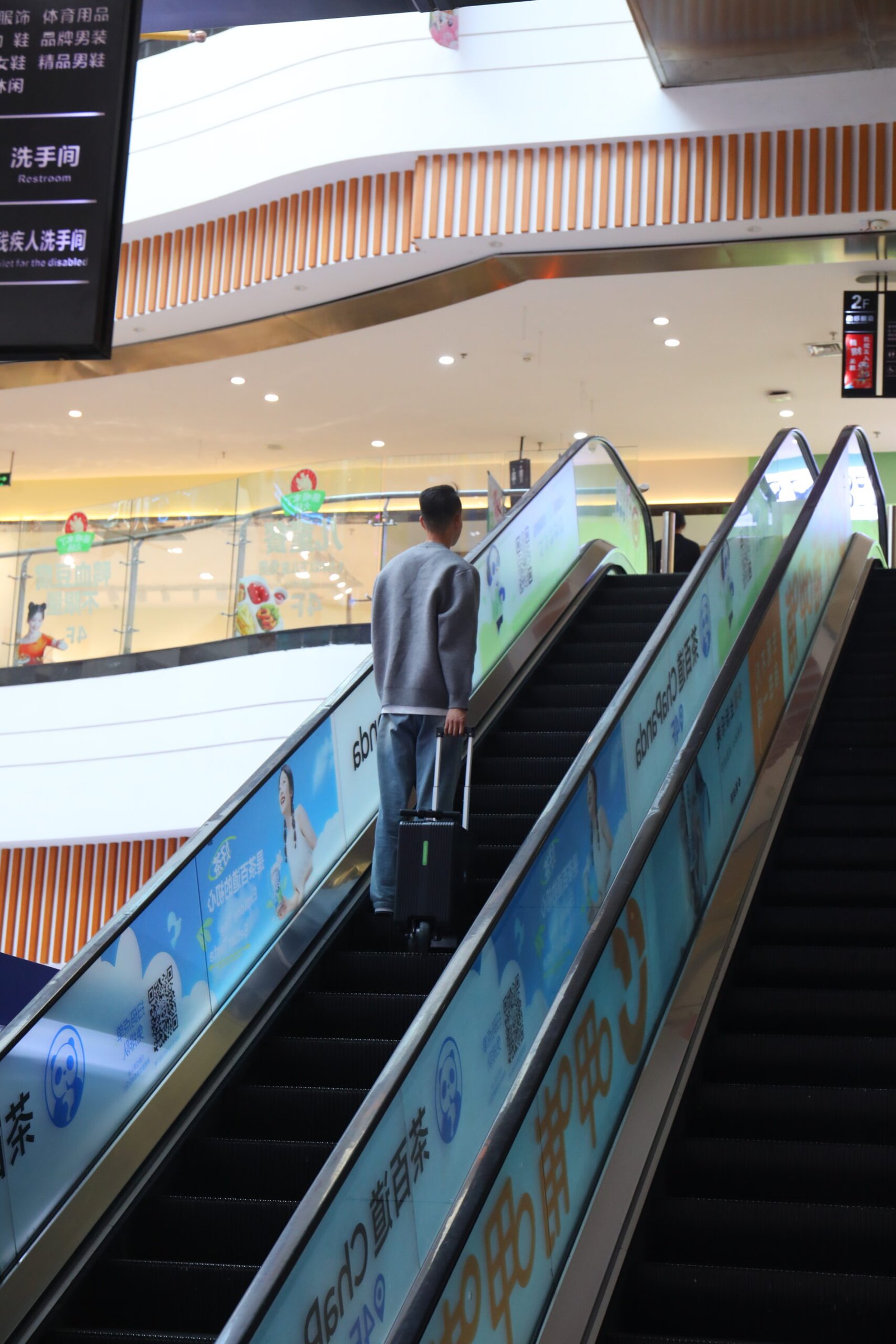 Taking the Glade smart luggage up an escalator